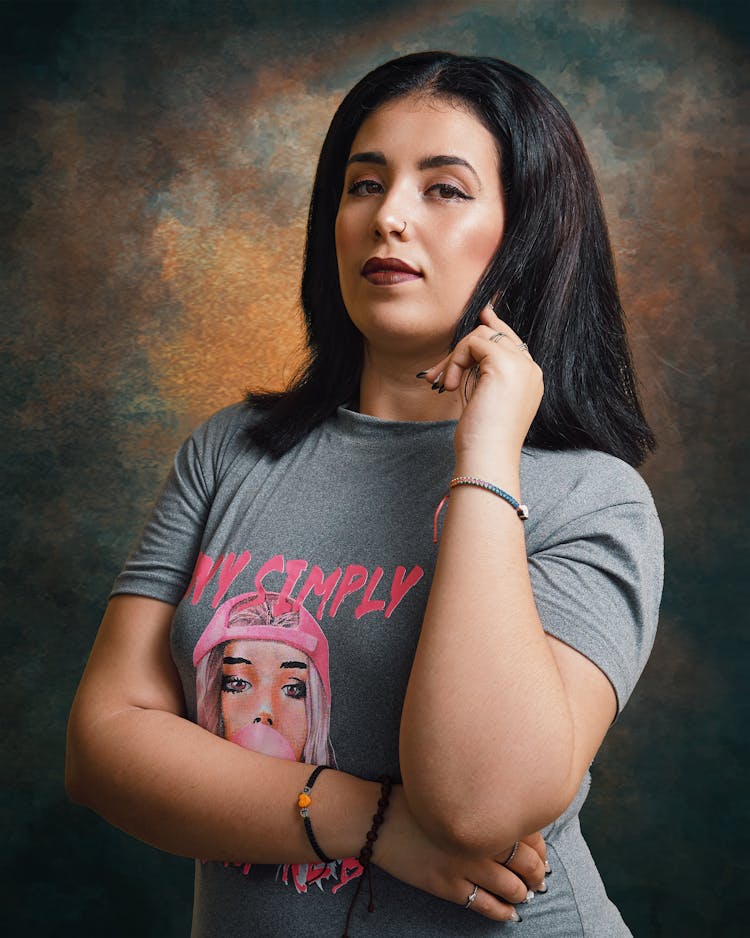 Young Brunette With Piercing In Nose Posing In Studio