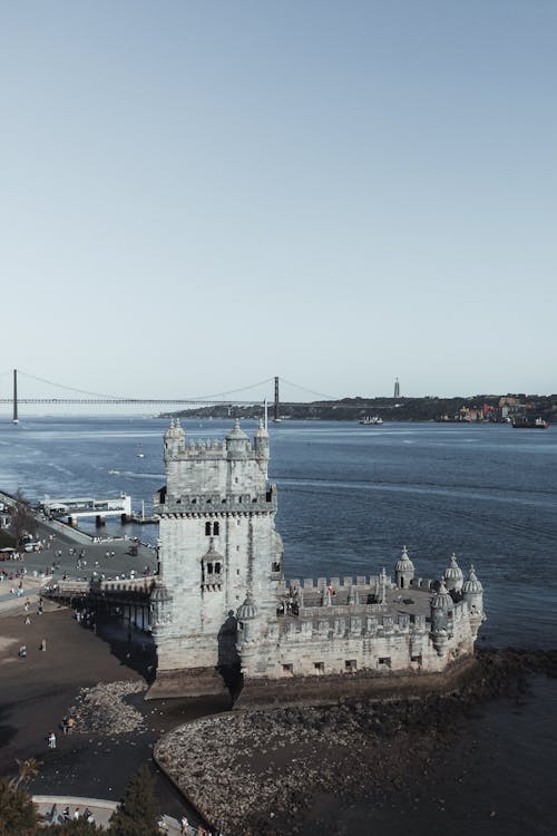 A tower with a bridge in the background