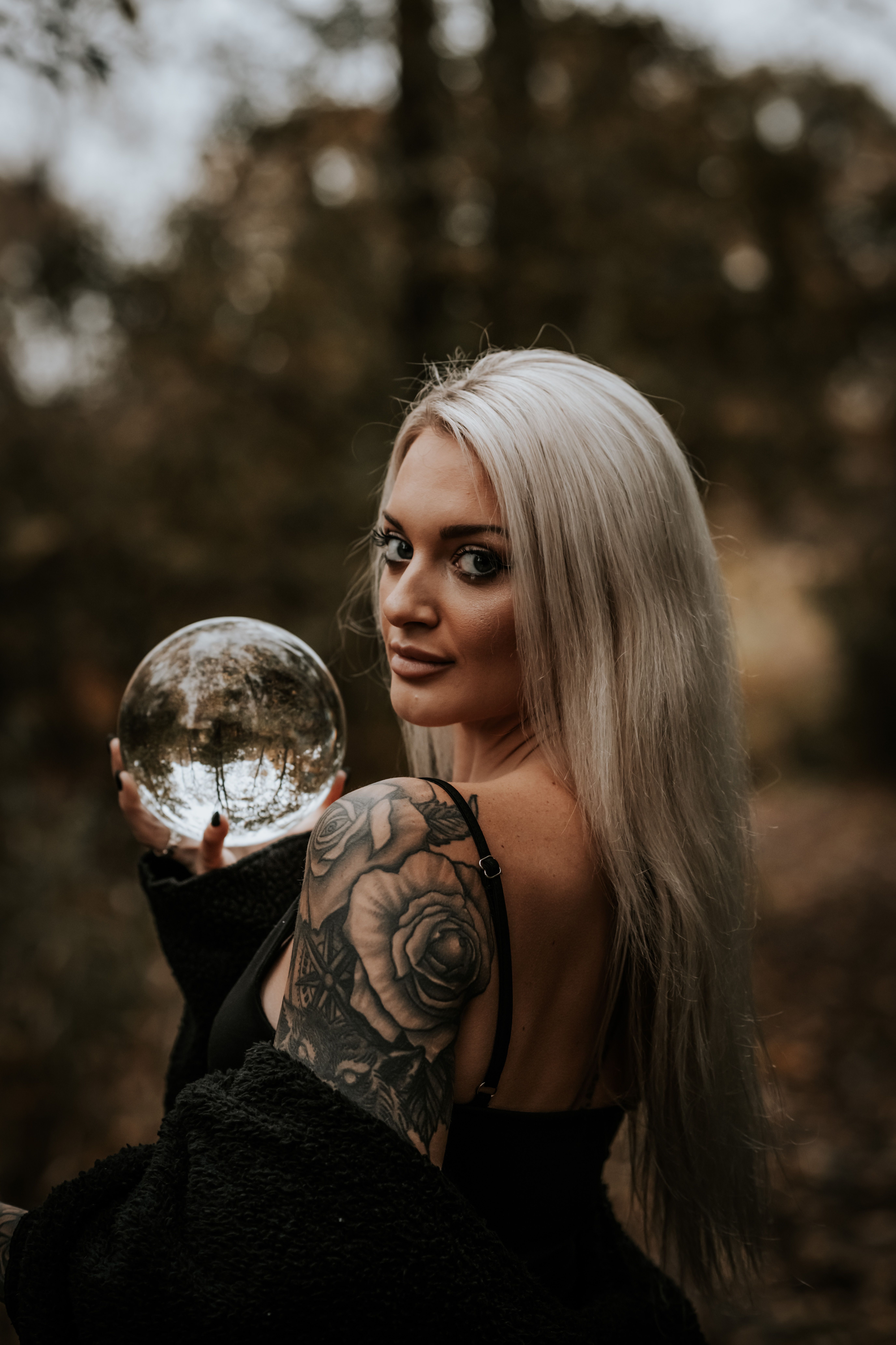 Portrait of a Young Tattooed Woman Holding a Crystal Ball · Free Stock ...