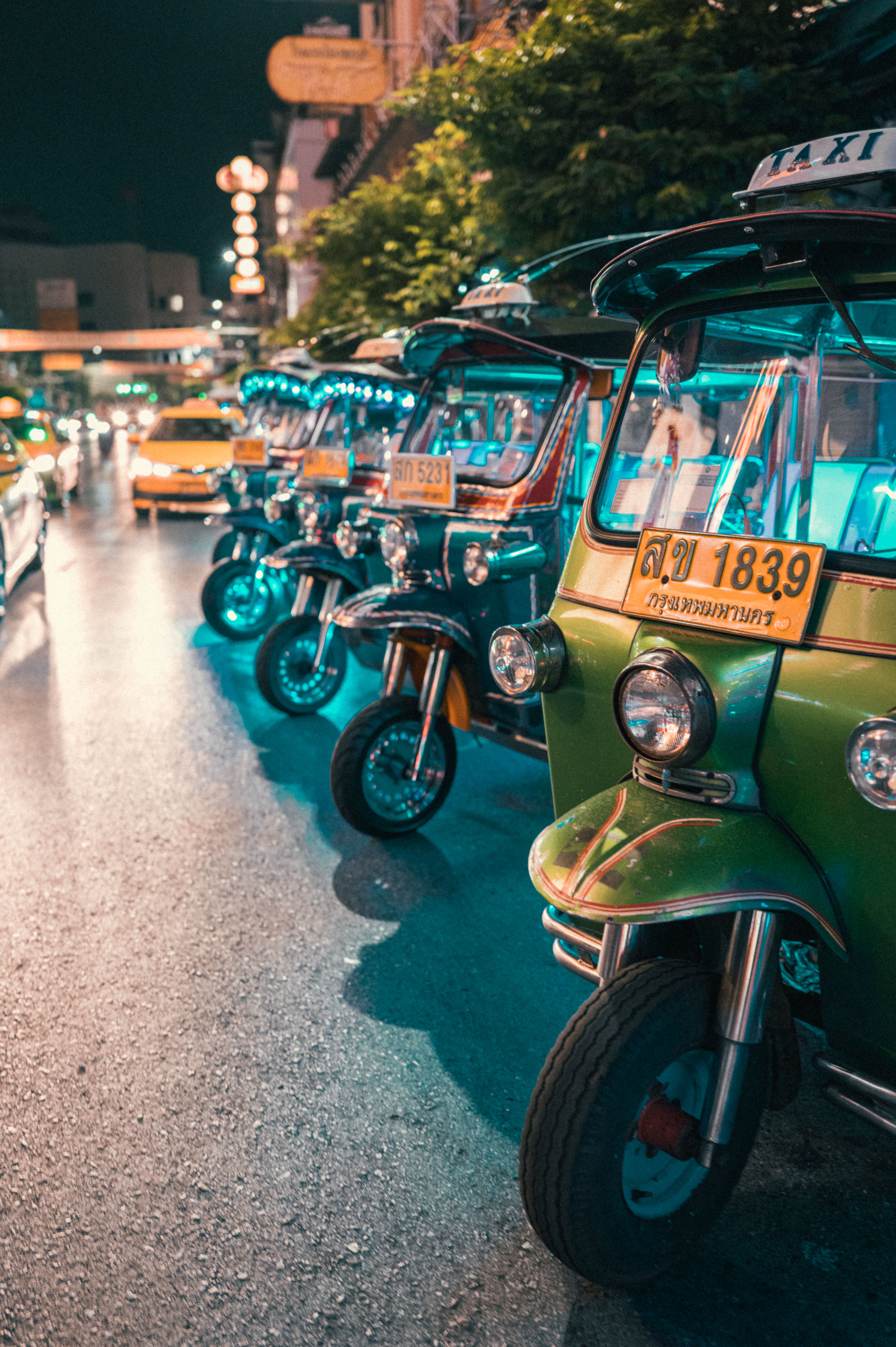 Motorbikes parked on a street in Thailand, evocative of everyday transport in Songkhla