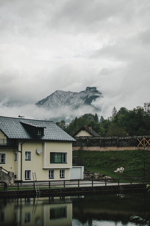 House by Lake in Village