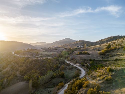 Free Beautiful sunset view of a winding road through mountainous terrain in Amasya, Türkiye. Stock Photo