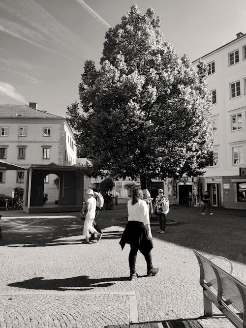 People on Square in Town in Black and White