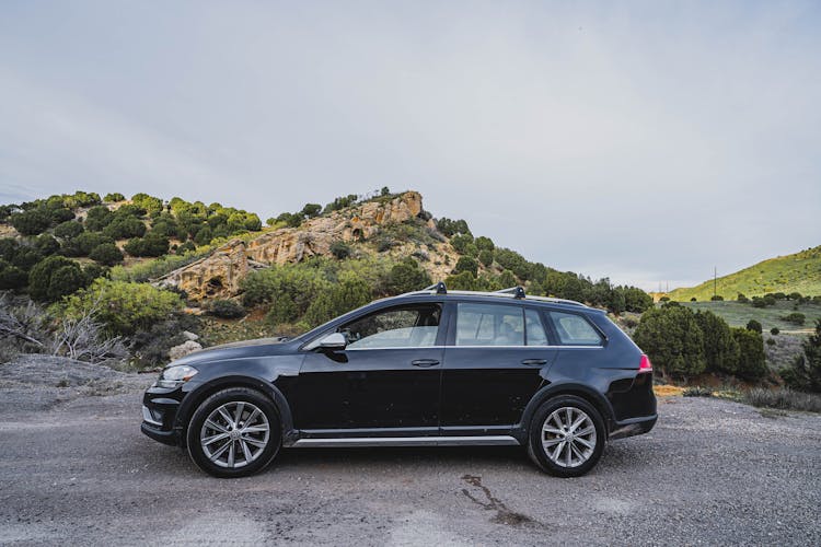 Black Car On A Road In Valley 