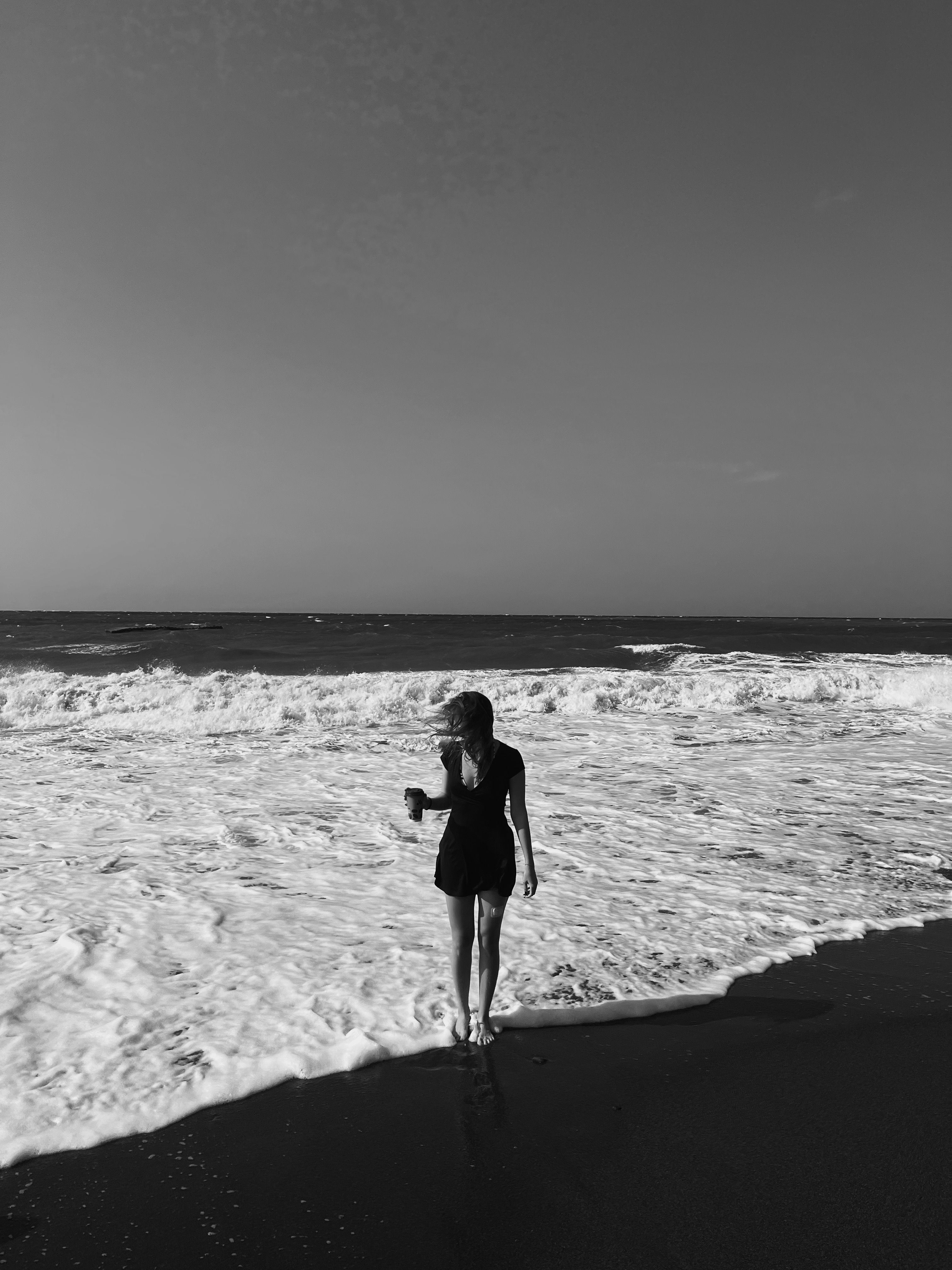 Woman on Sea Shore in Black and White · Free Stock Photo