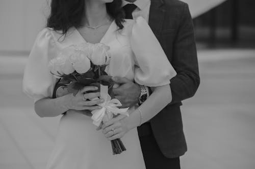 Close up of Hugging Newlyweds in Black and White