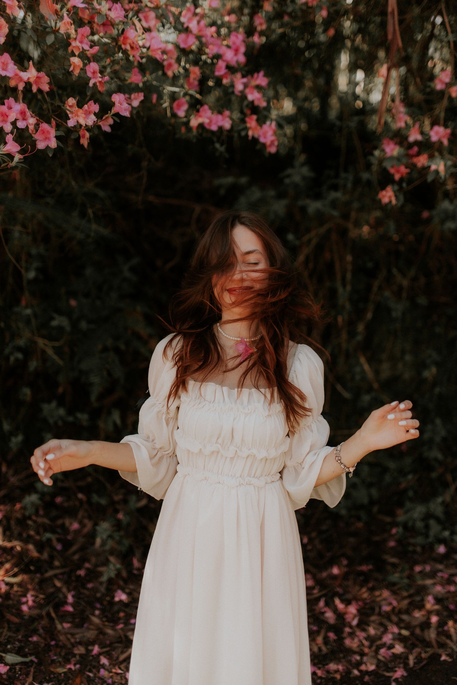 A brunette in a retro white dress