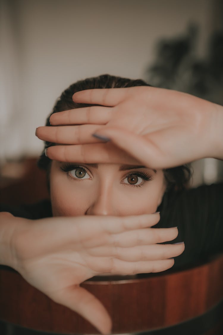 Woman Covering Face With Hands