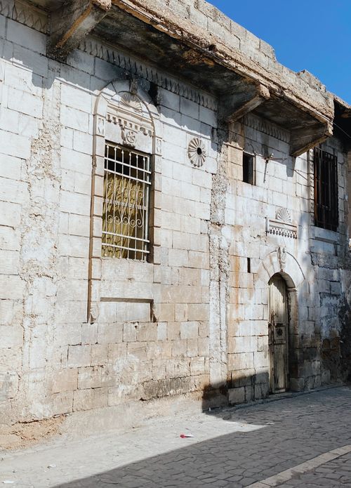 Free A historic stone building exterior in Şanlıurfa, Türkiye, showcasing ancient architecture. Stock Photo