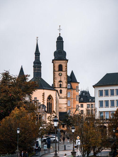 Free Vertical shot of historic church towers and urban architecture in Luxembourg City. Stock Photo