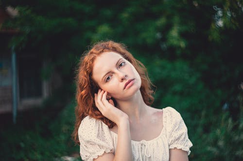 Beautiful Young Redhead Woman Posing in Green Park