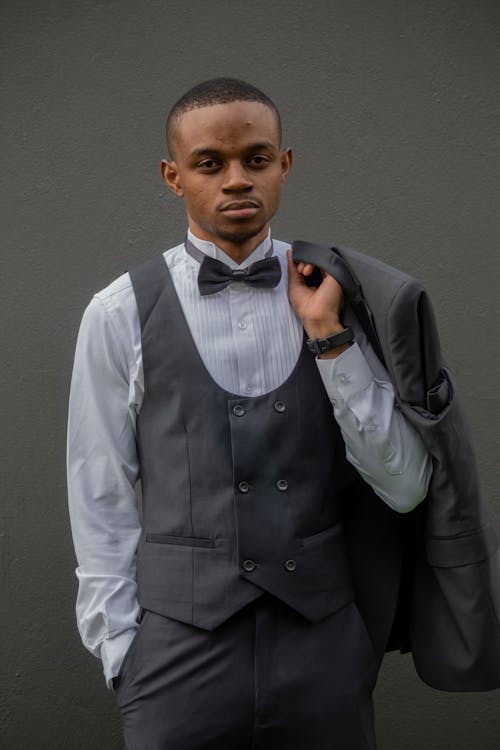 Model in an Elegant Gray Suit with a Bow Tie