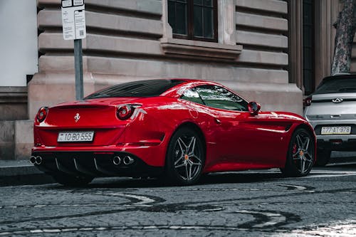 Foto profissional grátis de caro, carro vermelho, estacionado