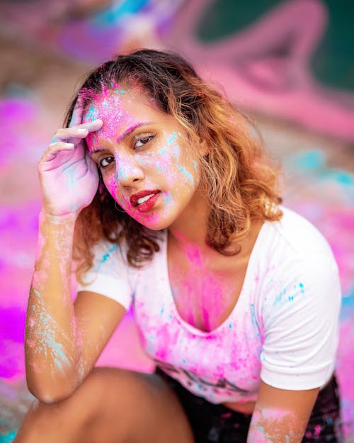 Woman Covered in Colored Powders