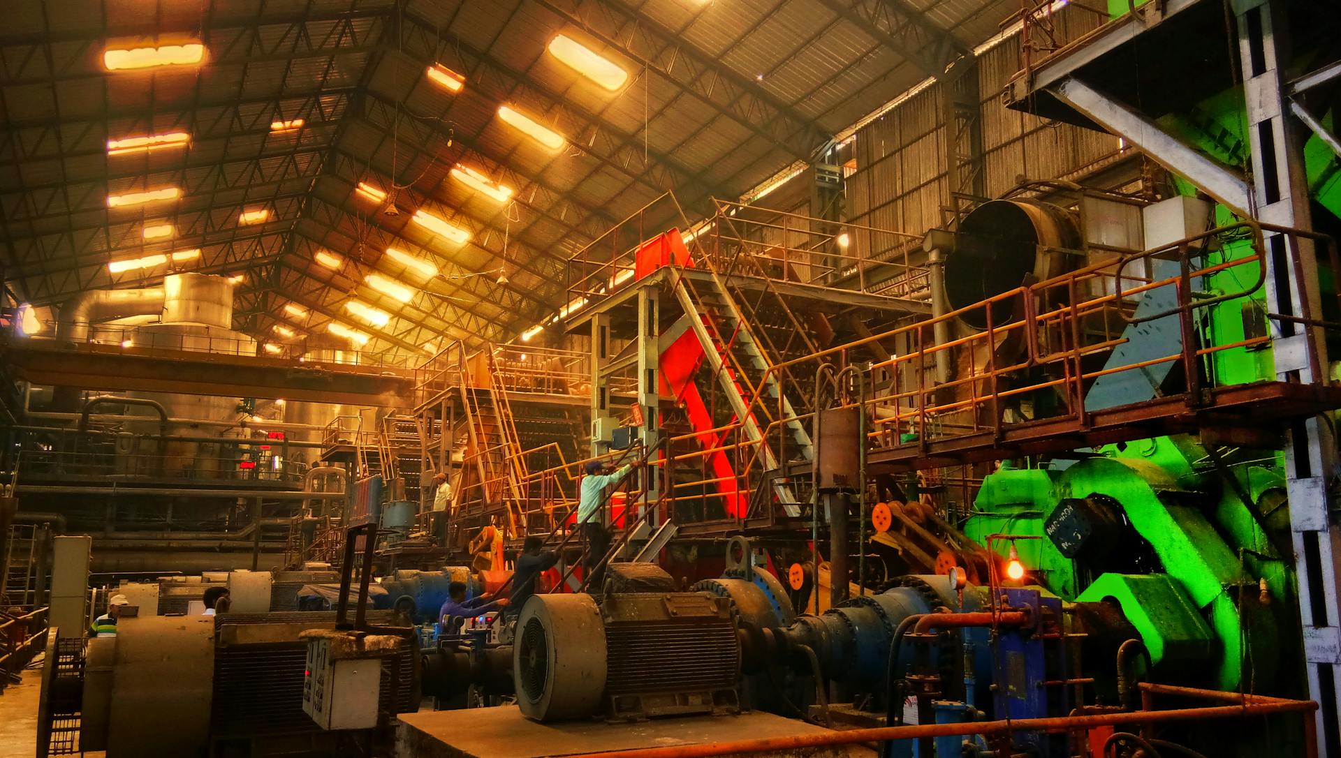 Detailed interior view of a bustling industrial factory in Ahmedabad, India.