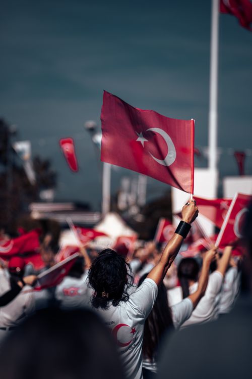 Free Crowd holding Turkish flags during an outdoor national celebration event. Stock Photo