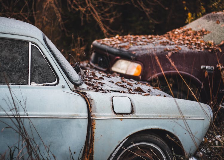 Abandoned Old Cars In Frost And Leaves In Countryside