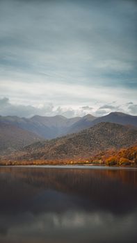 Stunning landscape of mountains and lake reflection in Kvareli, Georgia.