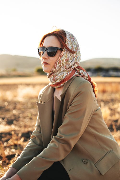 Woman in Headwear and Sunglasses in Countryside