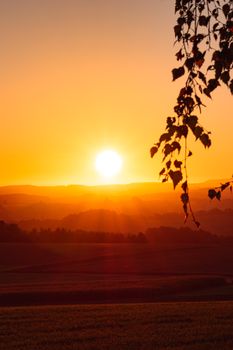 A breathtaking sunset over the rural landscape in Glashütte, Germany.