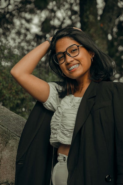 Portrait of Smiling Brunette Woman in Eyeglasses