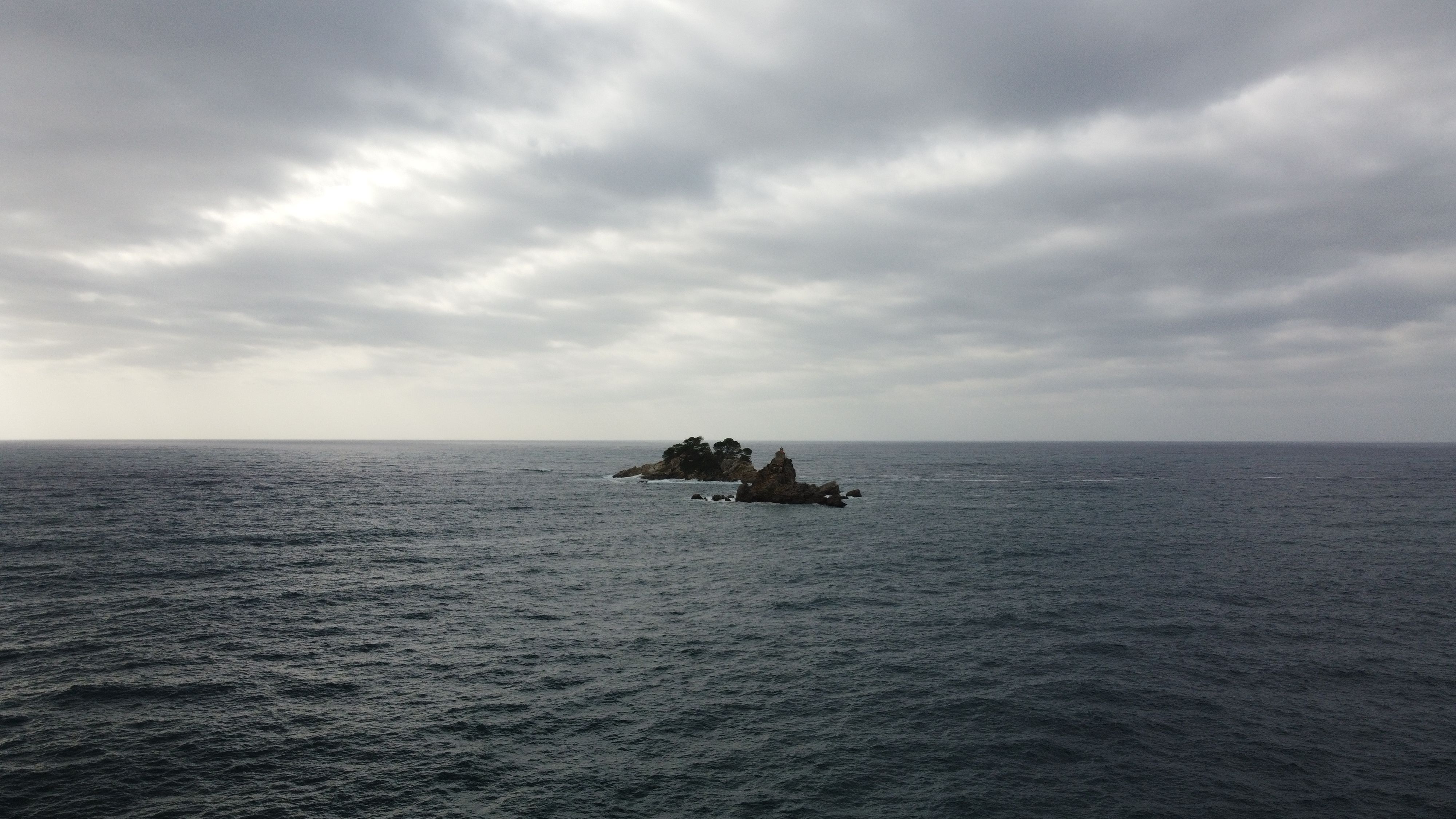 Dramatic cloudy seascape of Sveta Nedjelja Island, Montenegro.