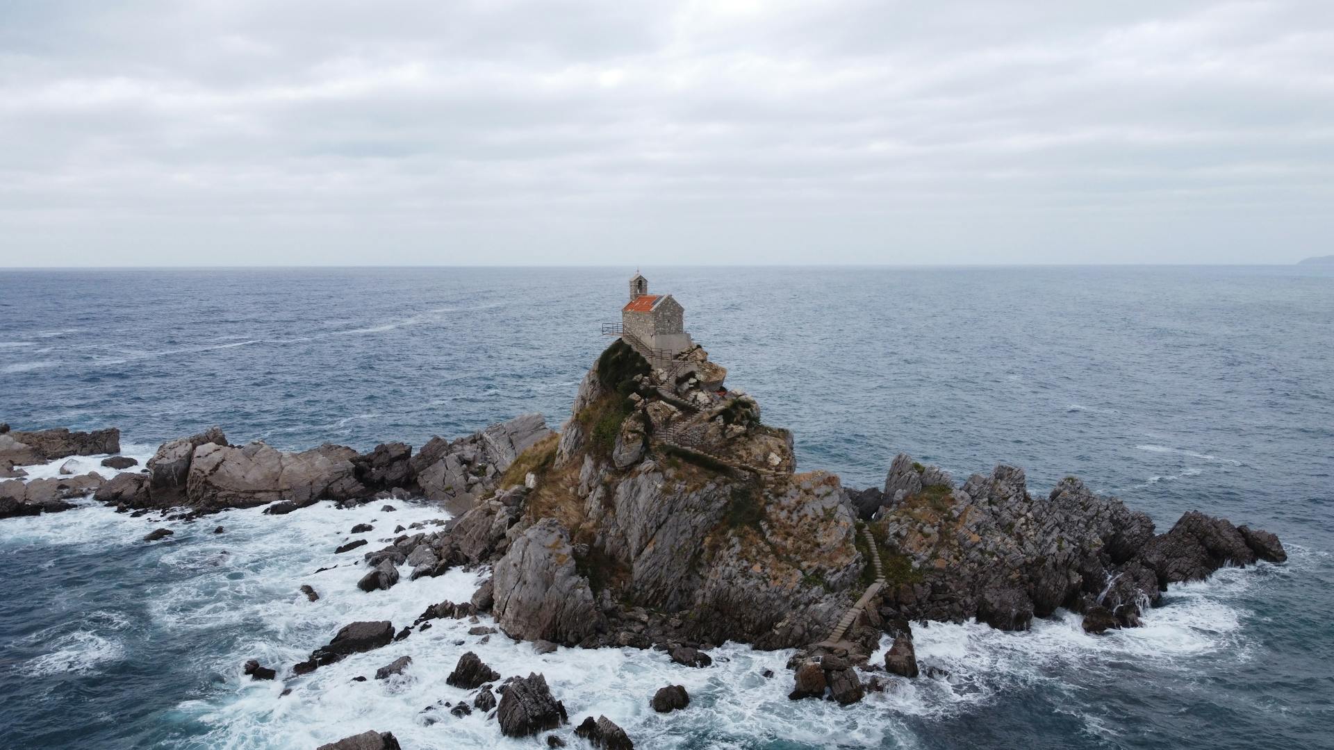 A church on a rock in Petrovac, Montenegro