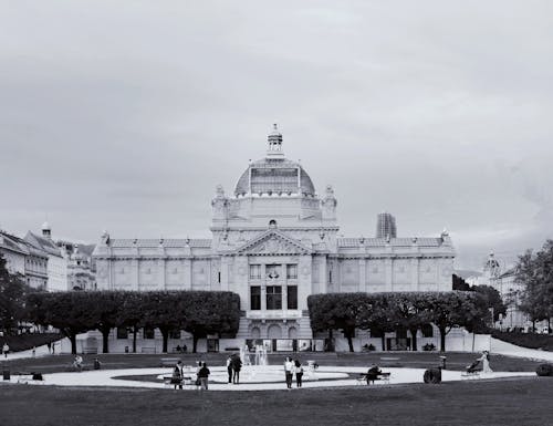 People in Park with Palace behind in Black and White
