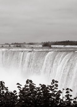 Stunning black and white photo capturing the powerful flow of Niagara Falls.