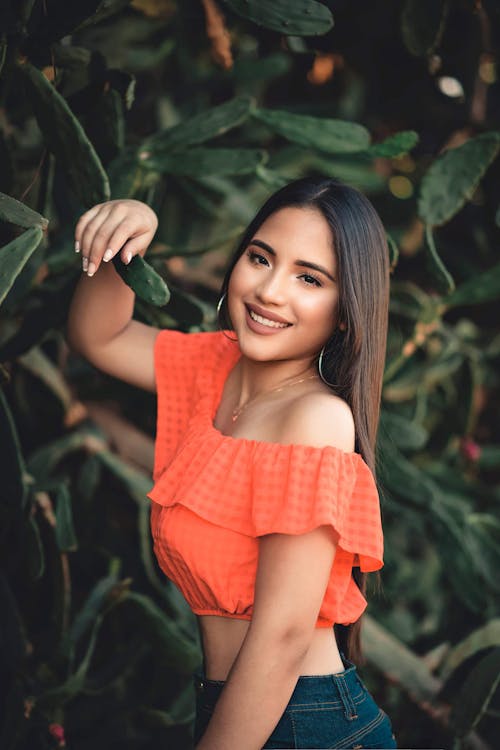 Woman Standing Beside Green Plant