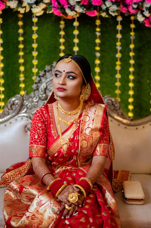 Woman Sitting in Traditional Clothing