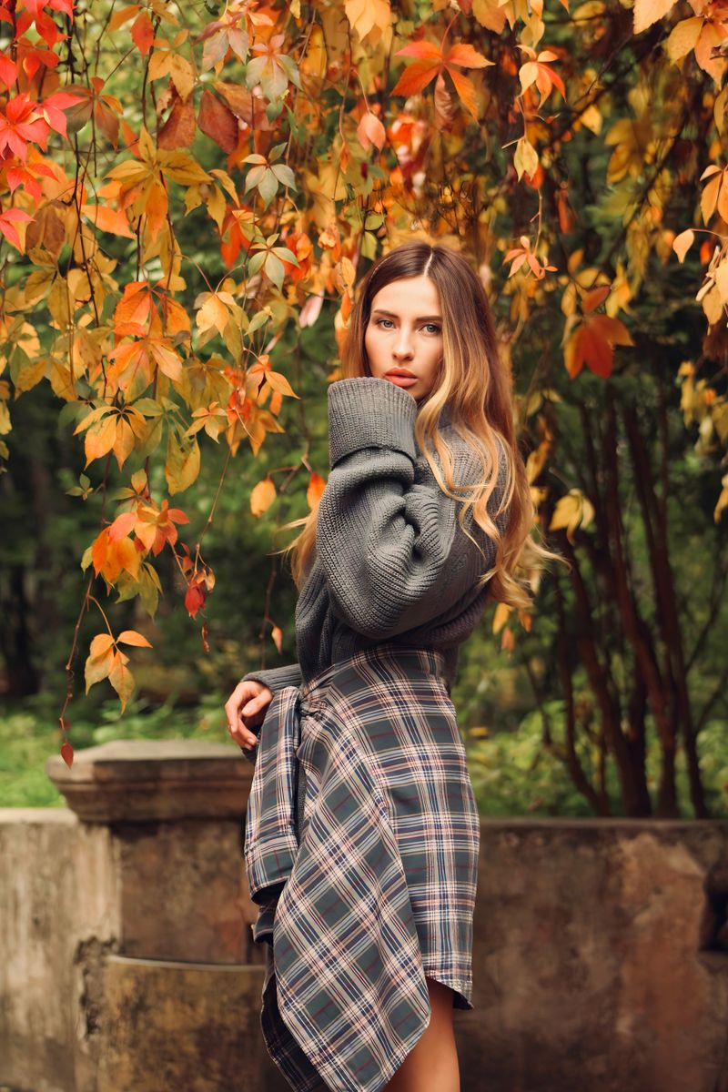 woman in a cozy knit sweater in autumn