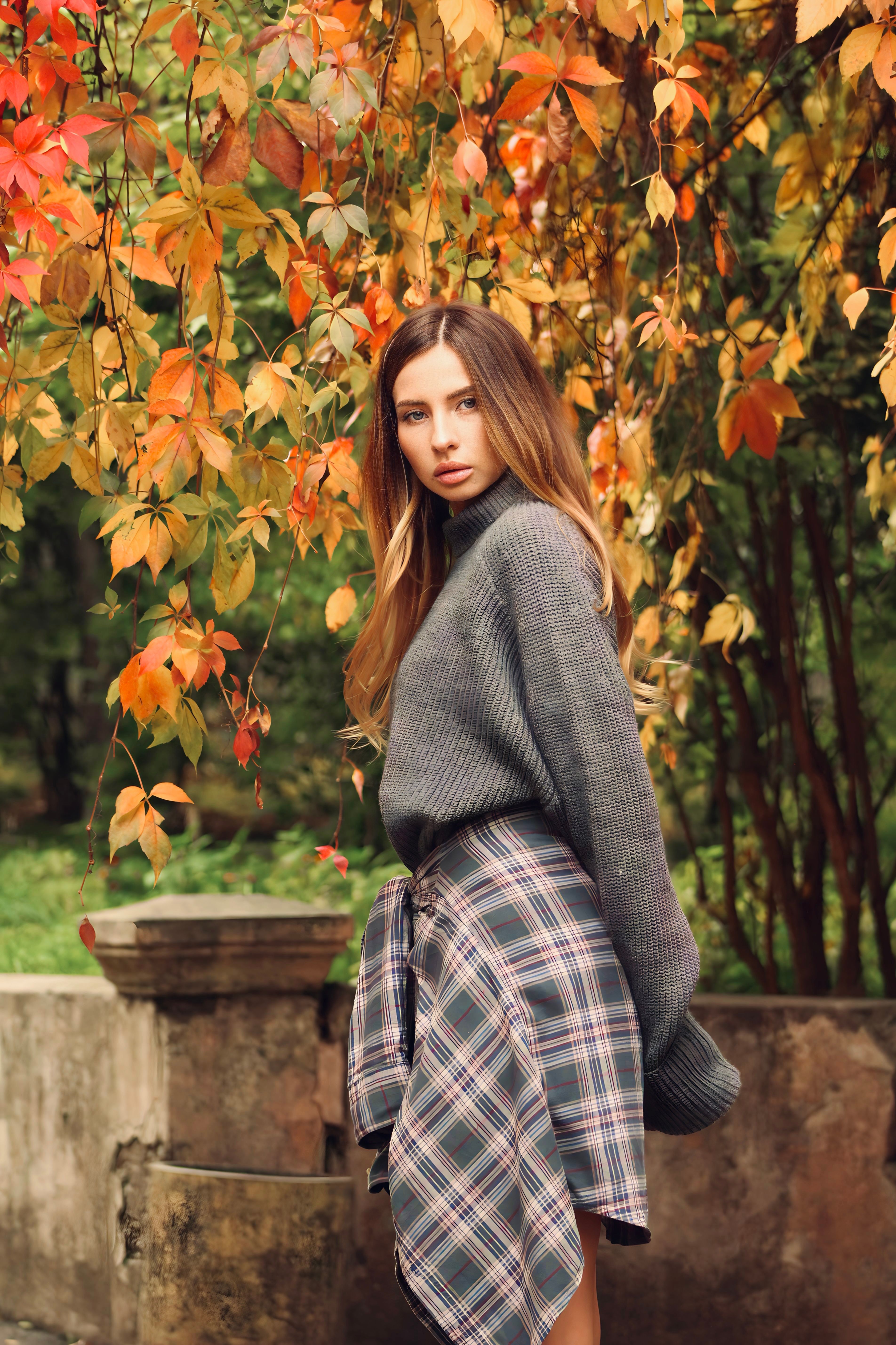 Woman in plaid wool skirt and black top