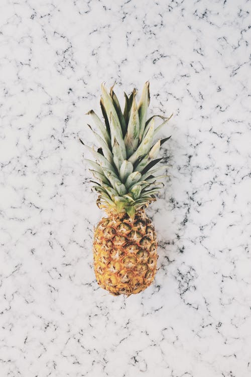 Pineapple on Top of White Surface