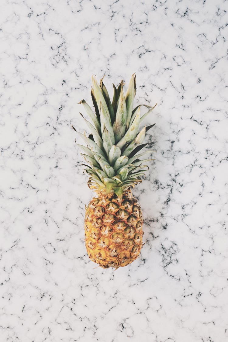 Pineapple On Top Of White Surface