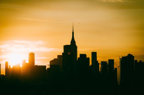 Free Silhouette of New York City skyline with Empire State Building at sunset. Stock Photo