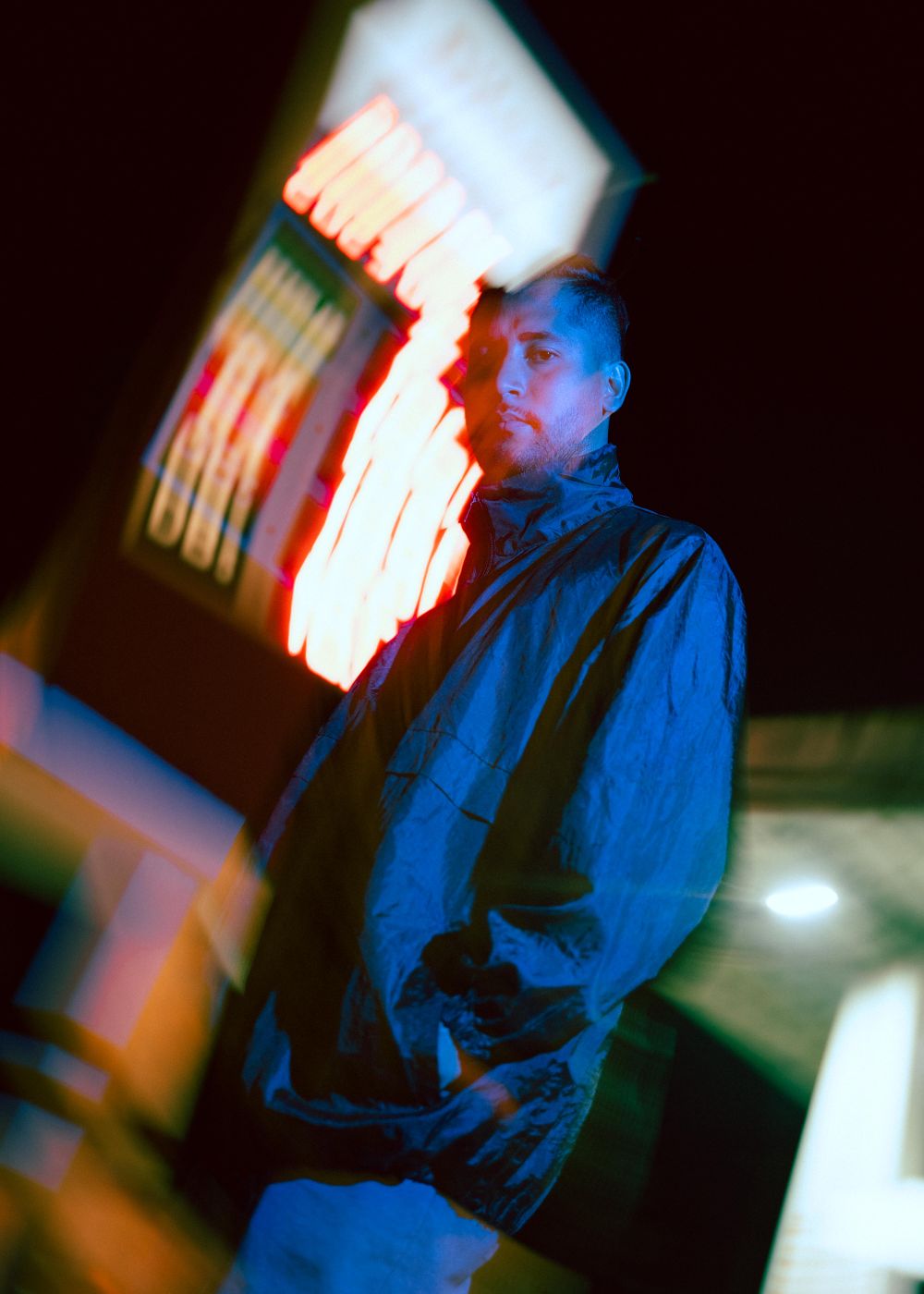 Neon-lit rainy street from the Neon Parish shoot