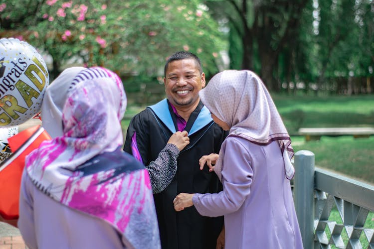 Traditional Asian Family In A Park