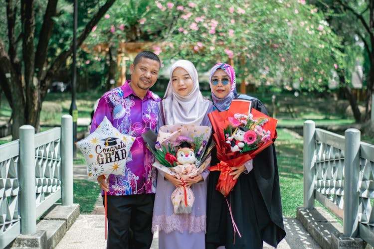 Traditional Asian Family In A Park