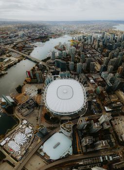Stunning aerial view capturing BC Place and Vancouver's bustling cityscape, perfect for travel and urban exploration themes.
