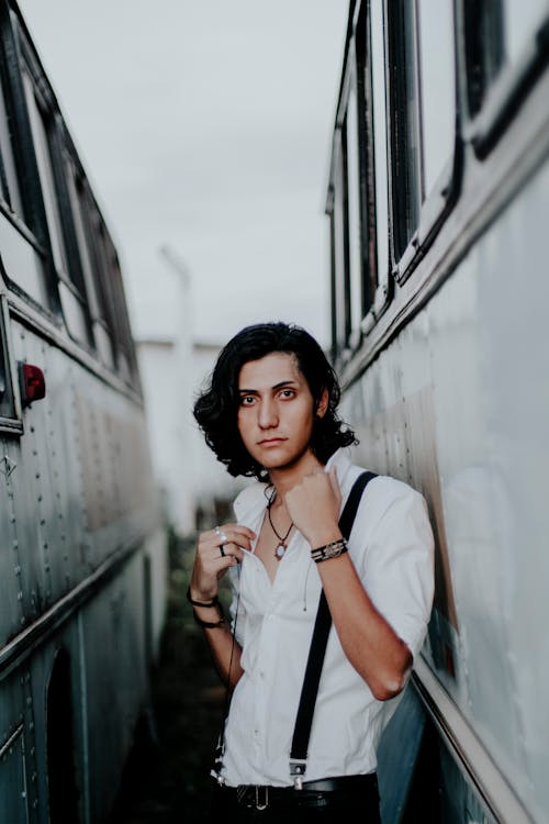 Free Man Standing Between on Bus Stock Photo