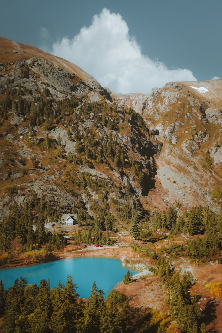 Lake And Rocky Hill Behind