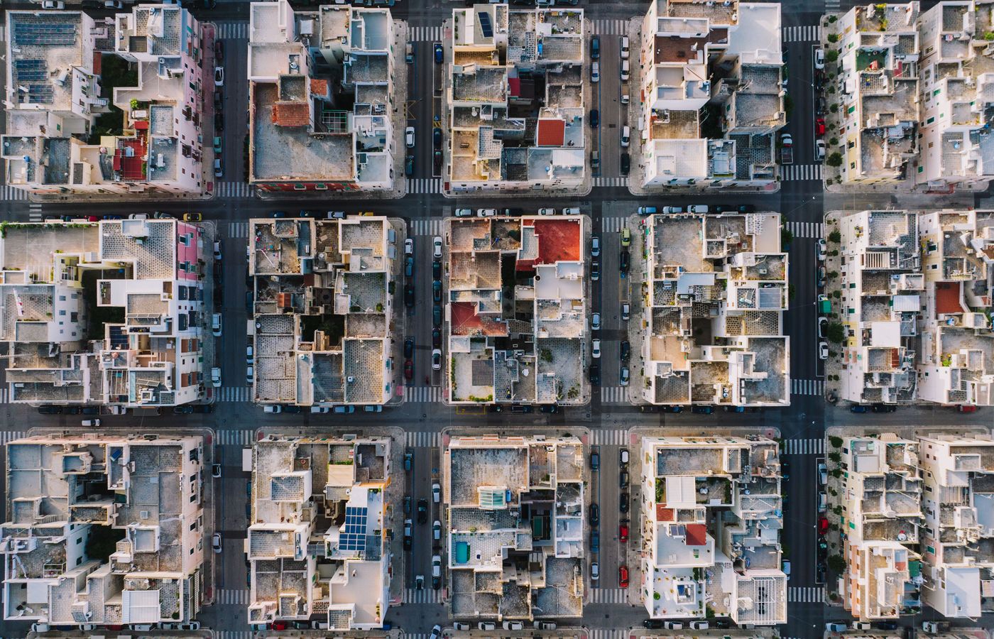 High-altitude aerial photo showing grid layout of Monopoli, Italy's residential district.