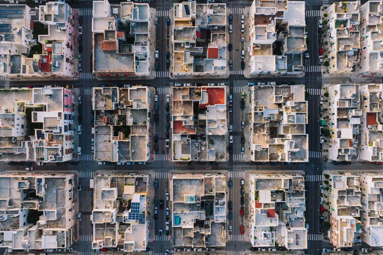 High-altitude aerial photo showing grid layout of Monopoli, Italy's residential district.