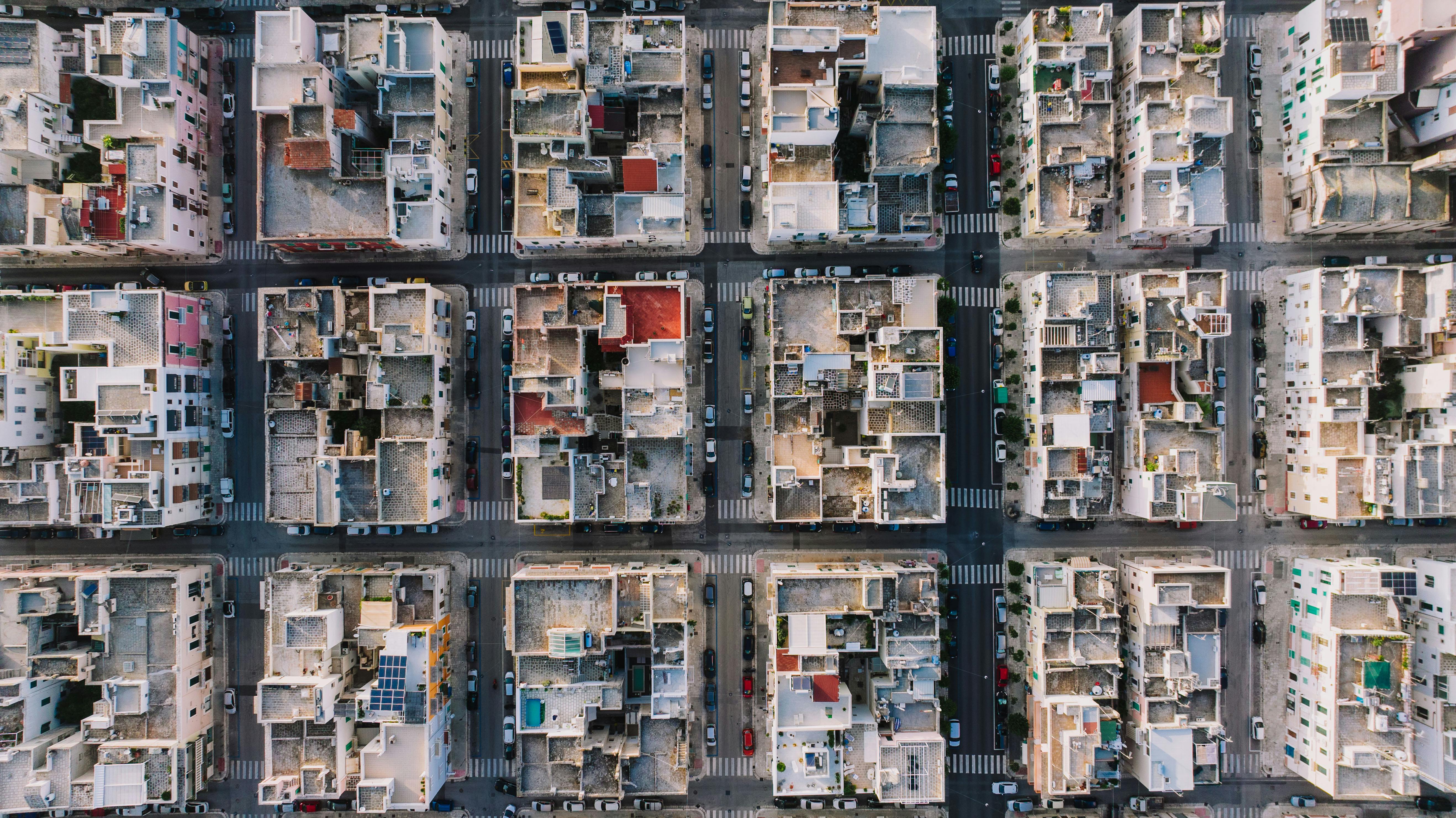 Aerial shot of Monopoli, Italy's urban residential grid pattern showcasing rooftop architecture.