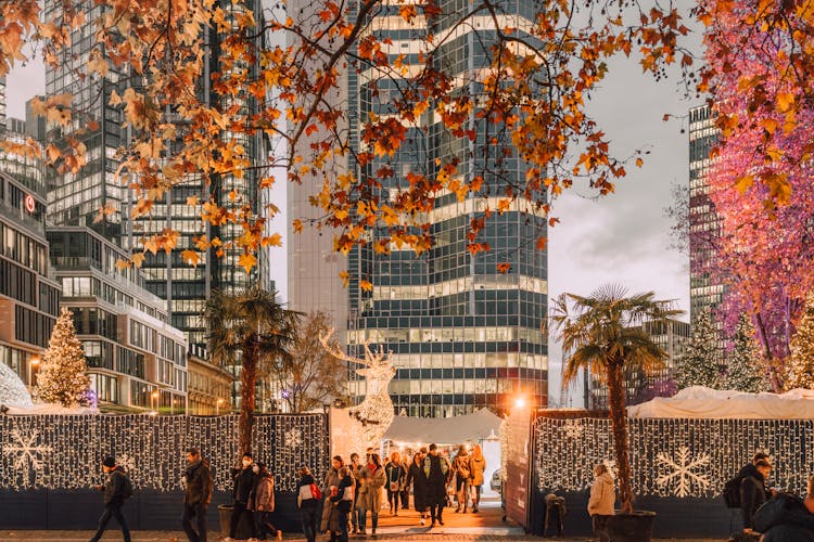 People Walking From A Christmas Market In Frankfurt, Germany