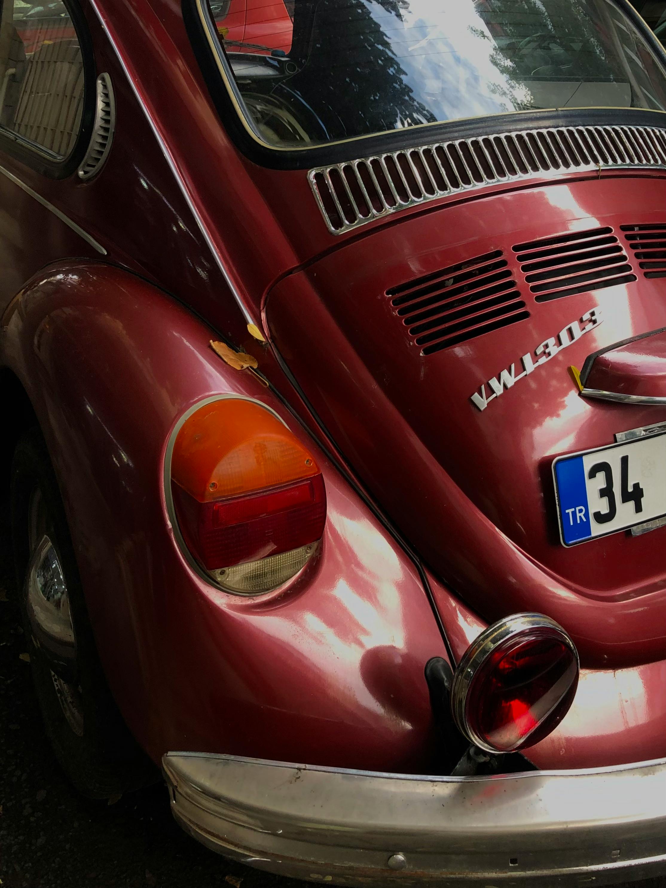 Close-up rear view of vintage red Volkswagen Beetle showing exterior details