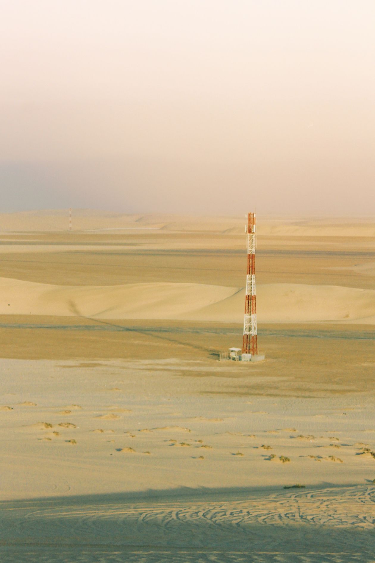 Cell tower in desert landscape aerial view