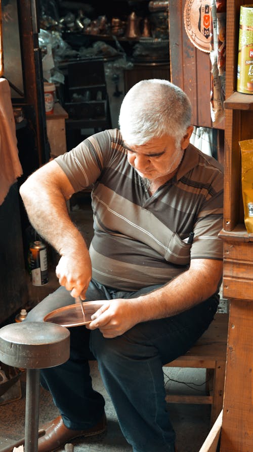 Man Grinding a Knife 