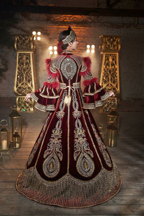 Free Intricate maroon and gold ornate wedding dress with traditional design and crown in Turkey. Stock Photo